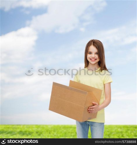 advertising, childhood, delivery, mail and people - smiling little girl holding open cardboard box over natural background