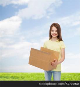 advertising, childhood, delivery, mail and people - smiling little girl holding open cardboard box over natural background