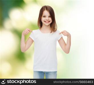 advertising, childhood, gesture, ecology and people - smiling little girl in white t-shirt pointing fingers on herself over green background