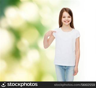 advertising, childhood, gesture, ecology and people - smiling little girl in white t-shirt pointing finger on herself over green background