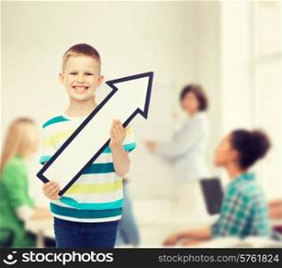 advertising, direction, education, teamwork and childhood concept - smiling little boy with white blank arrow pointing up over in classroom