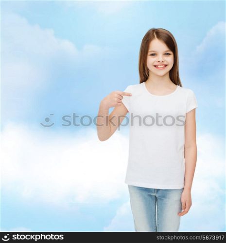 advertising, dream, childhood, gesture and people - smiling little girl in white t-shirt pointing finger on herself over cloudy sky background