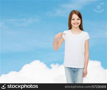 advertising, dream, childhood, gesture and people - smiling little girl in white t-shirt pointing finger on herself over blue sky background