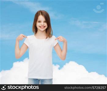 advertising, dream, childhood, gesture and people - smiling little girl in white t-shirt pointing fingers on herself over blue sky background