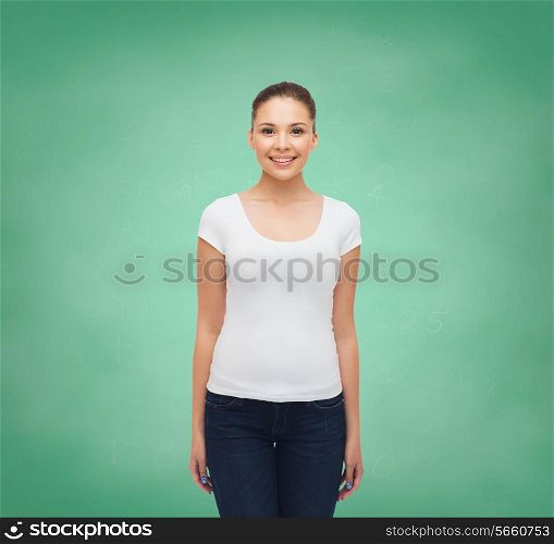 advertising, education, school and people concept - smiling young woman in blank white t-shirt over green board background