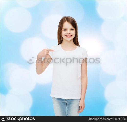 advertising, gesture, childhood and people - smiling little girl in white blank t-shirt pointing finger on herself over blue background