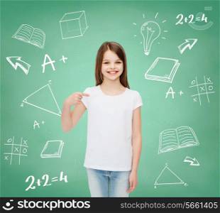 advertising, gesture, education, childhood and people - smiling girl in white t-shirt pointing finger on herself over green board with doodles background