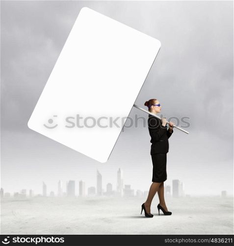 Advertising manager. Image of businesswoman holding blank banner. Place for text