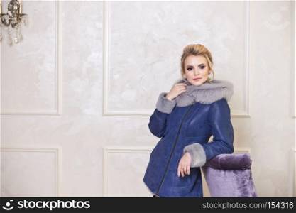 Advertising photography for sale fur coats and sheepskin coats.. Photo for the cover of a fashion magazine about winter outerwear 7462.