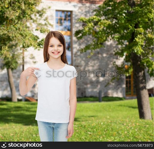 advertising, vacation, gesture, childhood and people - smiling girl in white t-shirt pointing finger on herself over campus background
