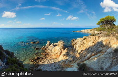 Aegean sea coast evening landscape with aquamarine water, view near Mega Portokali Beach  Sithonia, Chalkidiki, Greece .