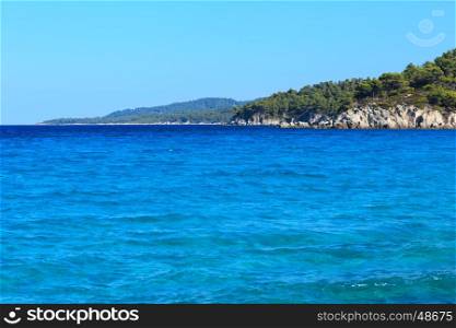 Aegean sea coast landscape with aquamarine water, view from Armenistis beach (Chalkidiki, Greece).