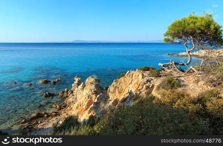Aegean sea coast landscape with aquamarine water, view near Mega Portokali Beach (Sithonia, Chalkidiki, Greece).