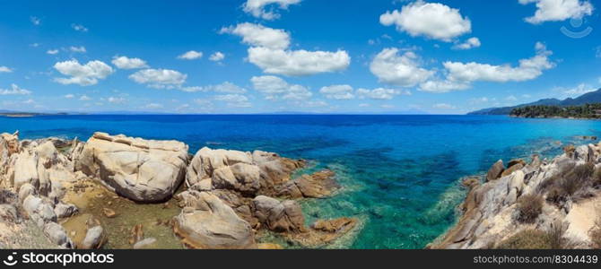 Aegean sea coast panorama and Karidi or Karydi beach (Chalkidiki, Greece). People are unrecognizable.