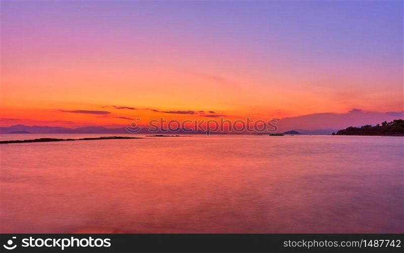 Aegean Sea in Aegina Island at twilight, Greece - Sunset landscape - seascape. Long exposition, the water is blurred by motion