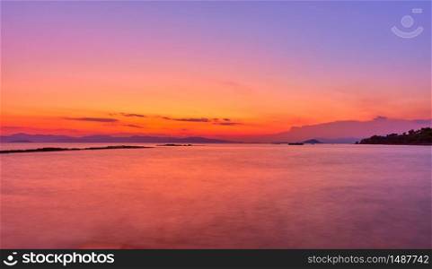Aegean Sea in Aegina Island at twilight, Greece - Sunset landscape - seascape. Long exposition, the water is blurred by motion