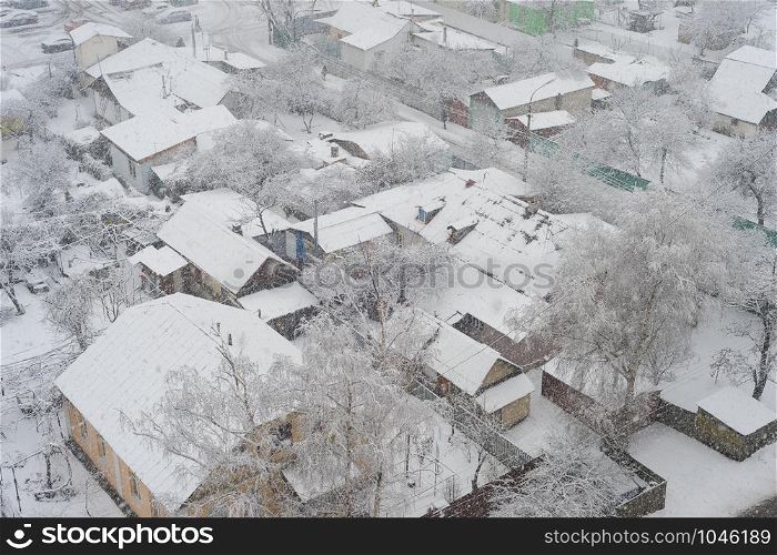 Aerail view of residential area and privat buildings in snowfall winter day, Kiev, Ukraine