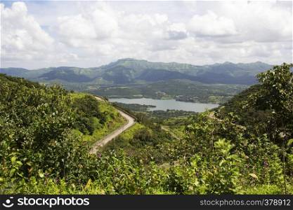 Aerial and scenic view of hilly road, backwaters of Khadakwasla dam, Sinhagad fort, Pune district. Aerial and scenic view of hilly road, backwaters of Khadakwasla dam, Sinhagad fort, Pune district.