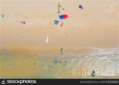 Aerial:Beautiful beach. PHUKET, THAILAND Patong beach. sandy beach and blue transparent water. Umbrella. Water scooter