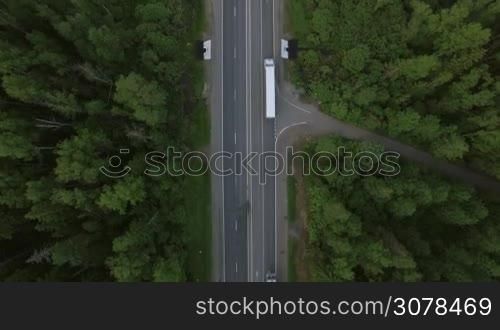 Aerial bird eye top view of road and moving cars in countryside, Moscow, Russia