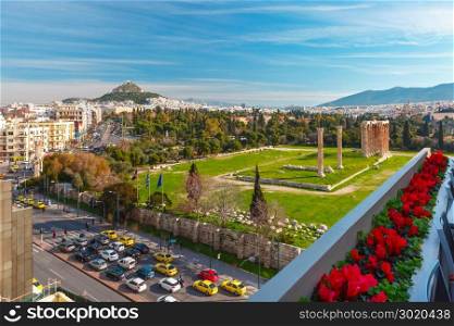 Aerial city view in Athens, Greece. Aerial city view with Ruins and a columns of the Temple of Olympian Zeus, Mount Lycabettus in the background, Athens, Greece