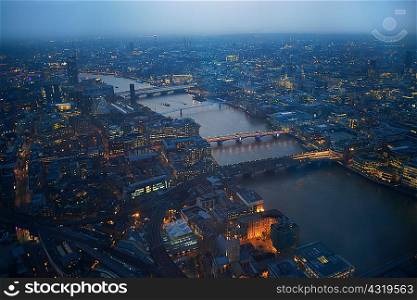 Aerial cityscape of river Thames and bridges at dawn, London, England, UK