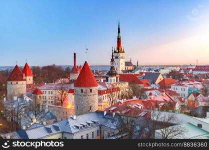 Aerial cityscape with Medieval Old Town, St. Olaf Baptist Church and Tallinn City Wall in the morning, Tallinn, Estonia. Aerial view of old town in Tallinn, Estonia