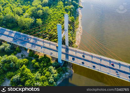 Aerial Drone Flight top down View of freeway busy city rush hour heavy traffic jam highway. Aerial view of the vehicular intersection, traffic at peak hour with cars on the road. Bridge Top View