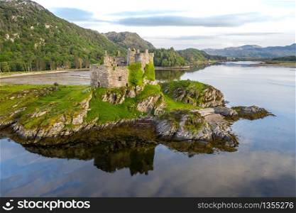 Aerial drone shot of Castle Tioram, it is a ruined castle that sits on the tidal island Eilean Tioram in Loch Moidart, Lochaber, Highland, Scotland. It is located west of Acharacle.