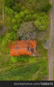 Aerial drone view of old ruined house in the field