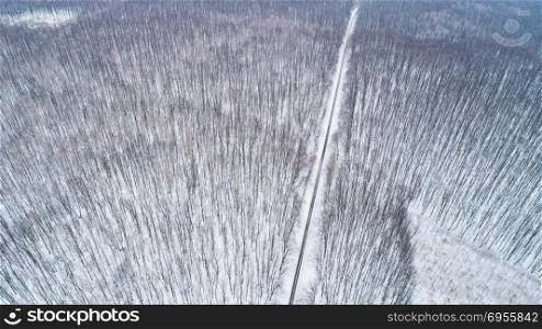 Aerial drone view of road in idyllic winter landscape