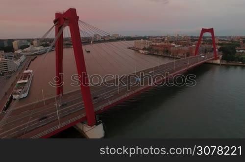 Aerial evening scene of Willem Bridge with car traffic in Rotterdam, Netherlands