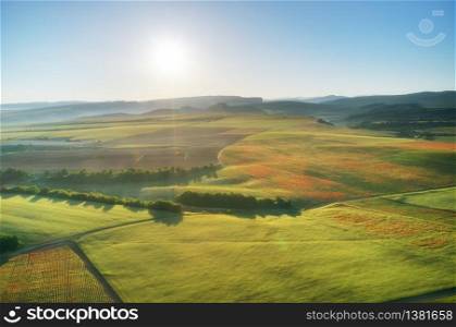 Aerial fields and meadow in mountain. Beautiful country area. Nature landscape.