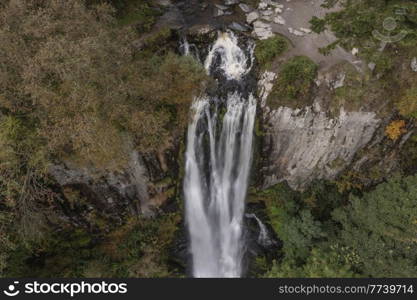 Aerial flying drone Beautiful long exposure landscape early Autumn image of Pistyll Rhaeader waterfall in Wales