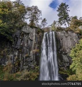 Aerial flying drone Beautiful long exposure landscape early Autumn image of Pistyll Rhaeader waterfall in Wales