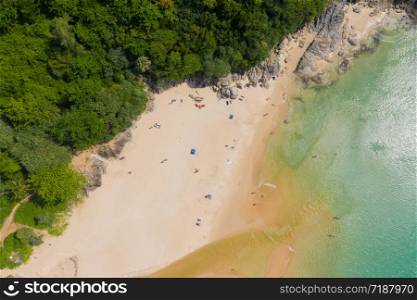 Aerial flying drone view of Kot Noi Beach white sandy beach on sunny tropical paradise island with aqua blue sky sea water ocean. Phuket