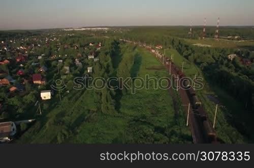 Aerial - Freight trains making their way through the countryside, Russia