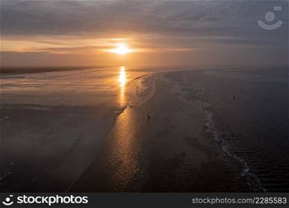 Aerial from a beautiful sunset at thje Wadden Sea in Friesland the Netherlands