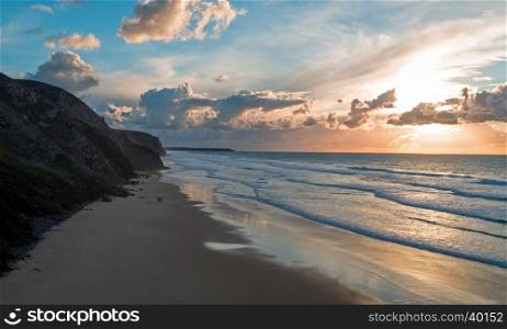 Aerial from a beautiful sunset at Vale Figueiras beach in Portugal