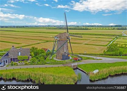 Aerial from a traditional windmill in the countryside from the Netherlands