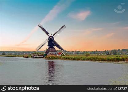 Aerial from a traditional windmill in the countryside from the Netherlands at Kinderdijk at sunset