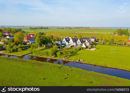 Aerial from a typical dutch landscape in the Netherlands on a beautiful summer day