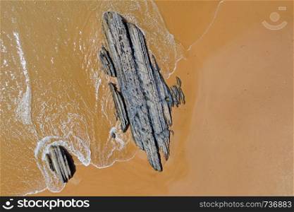 Aerial from natural rocks on Vale Figueiras beach in Portugal