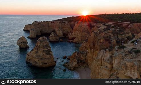 Aerial from Praia da Marinha in the Algarve Portugal at sunset
