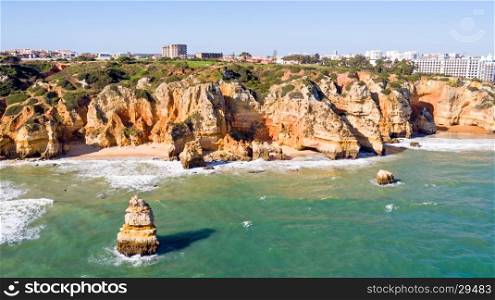 Aerial from rocks and ocean near Lagos in Portugal