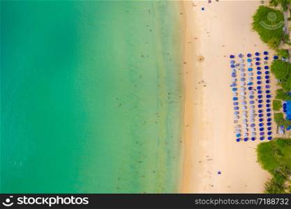 Aerial High angle view of people enjoy swimming and relax on the beach in Phuket Thailand Patong beach is a very famous tourist destination in Phuket 4k aerial view Drone top down Beautiful beach