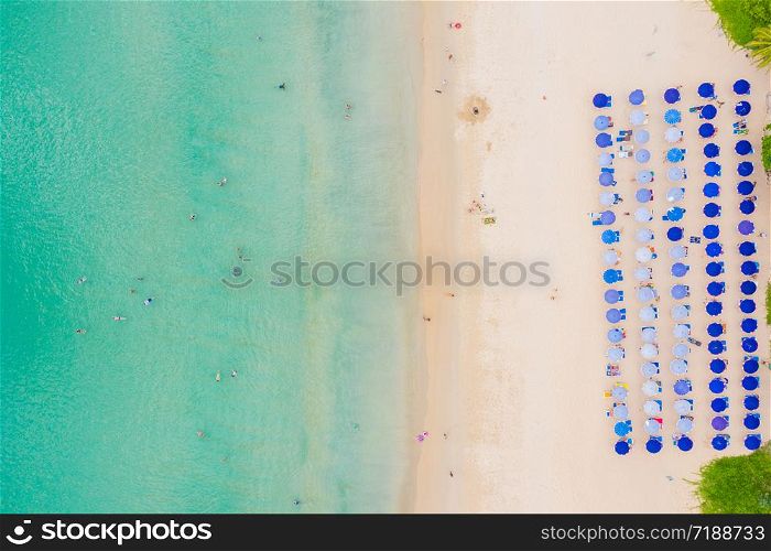 Aerial High angle view of people enjoy swimming and relax on the beach in Phuket Thailand Patong beach is a very famous tourist destination in Phuket 4k aerial view Drone top down Beautiful beach