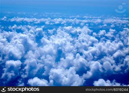 Aerial high view of blue clouds on blue sea