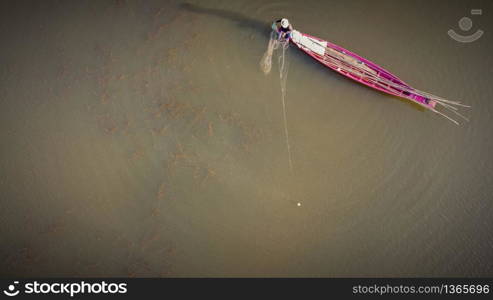 Aerial image, Fishing boat fishing in the lake in sunset time.