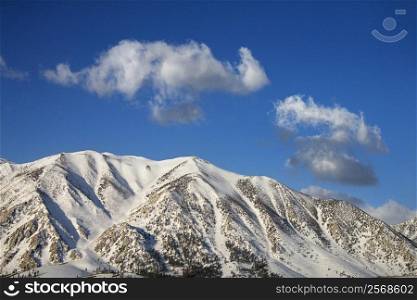 Aerial landscape of snow covered mountain peaks in California, USA.